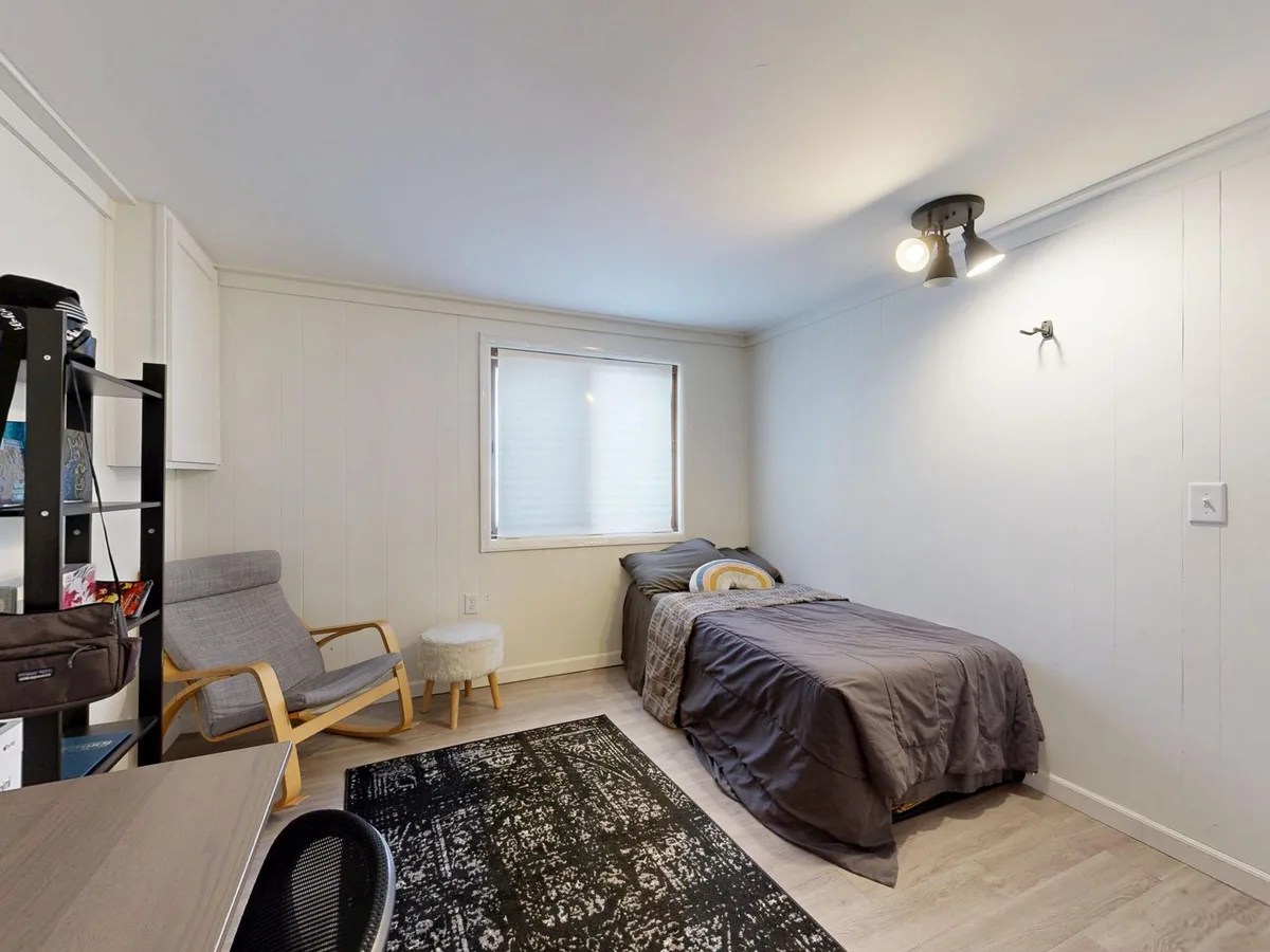 Cardiff HMO bedroom being measured for compliance with licensing standards
