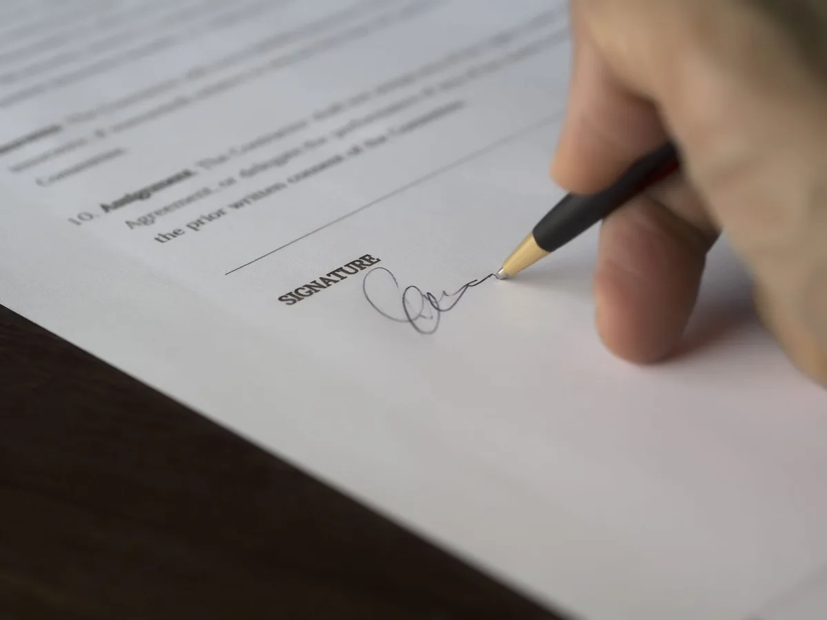 Cardiff student reviewing a guarantor agreement with a parent before signing